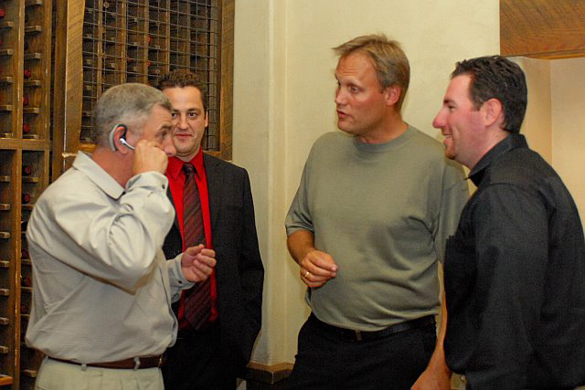 General John Abizaid, Shaun Masterman (Headsets.com), Boris Seibert (Director of Sales, Western Region, Plantronics) and Chris Hicken (Headsets.com) . General Abizaid trying the Plantronics Voyager 510 headset.